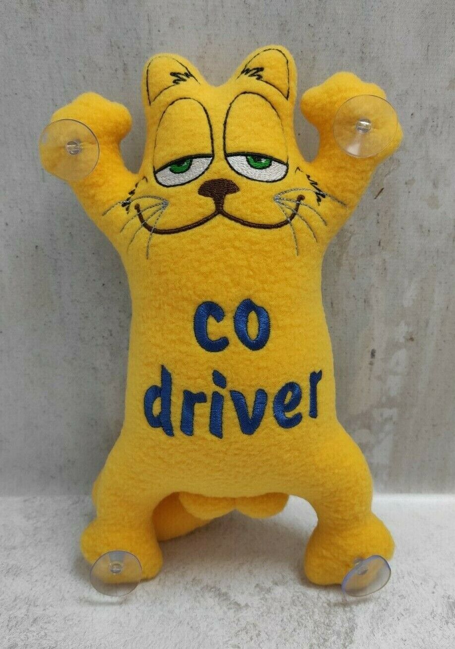 Cat in the car on suction cups, handmade soft toy With a car log