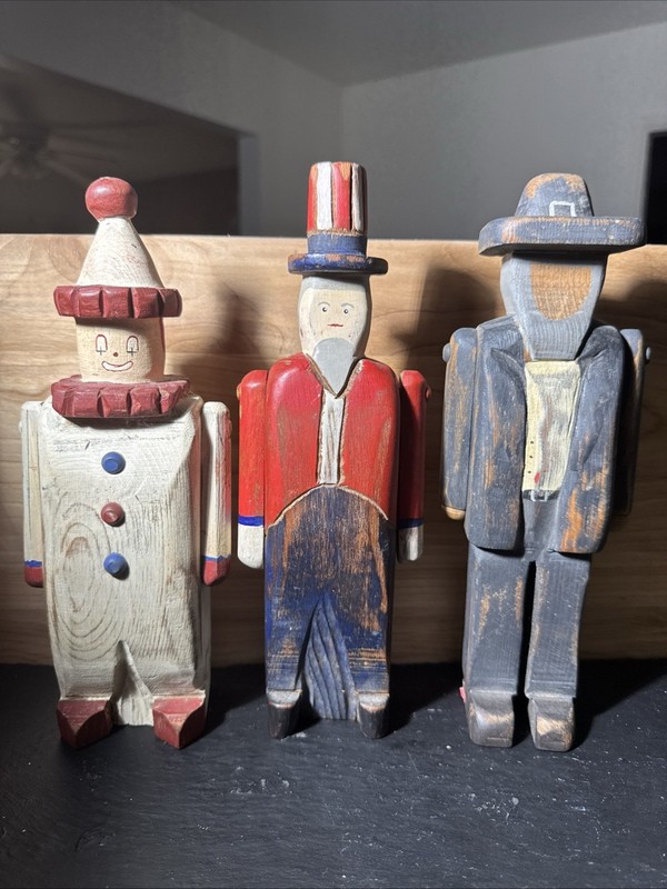 Set Of 3 Wooden Folk Art Figurines: 2 Marked Wolf Creek 1 Unidentified Mark 10”H