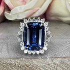 4 Ct Emerald Cut Lab-Created Sapphire Halo Engagement Ring 14k White Gold Plated