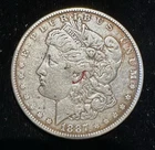 Morgan Dollar - 1887 - Red Ink spot behind hair