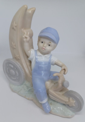 Vintage figurine Little Boy Riding Tricycle Moon Stars Peace Sign Train Hat EUC