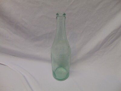vintage Star Water Miracle glass bottle green tint 3/2 I 11.5'' tall USA