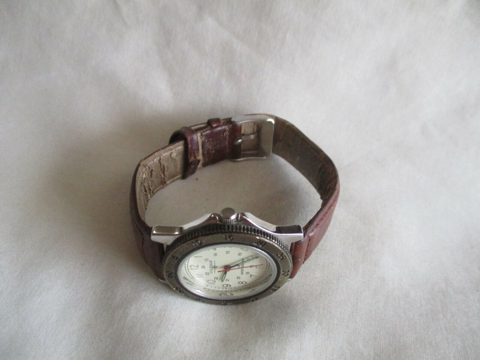 Coleman Analog Wristwatch with a Buckle Band and Water Resistance