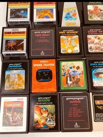 Atari 7800 console with 35 games, 2 controllers, power cord, storage case WORKS