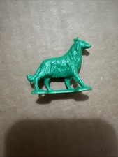 Processed Plastic Dog. German Shepherd. Green Plastic 1970s - 2000s
