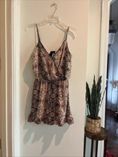 women  s Romper Size M, Adjustable Straps, Lined, Gathered Waist.