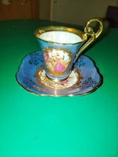 KPM Courting Couple Demitasse tea Cup and Saucer Footed periwinkle gold trim