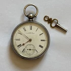 Sterling silver antique pocket watch by A W Co “Waltham mass”  working with key