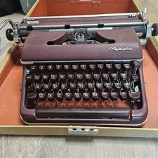 Vintage Cranberry 1961 Olympia DeLuxe Typewriter with case, in great condition
