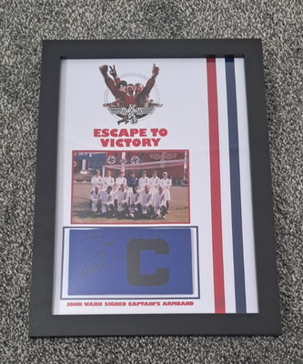 John Wark - Escape to Victory - Signed Captain's Armband - A4 Display