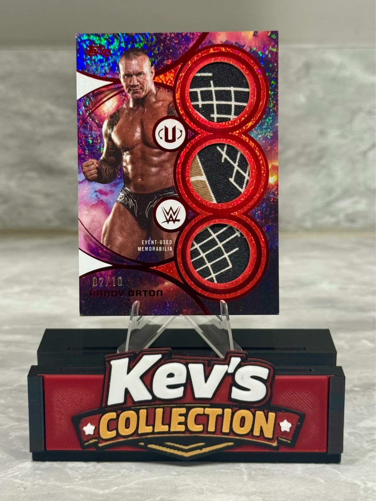 Randy Orton - 2026 Topps Universe Superstar Triple Relics Red Magma /10 STR-RO