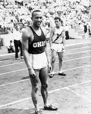Ohio State University track star Jesse Owens stands on the track a- Old Photo