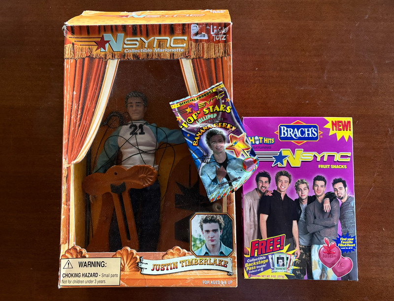NSYNC JT Marionette Doll 2000, unopened Brach's fruit snacks, and JT candy