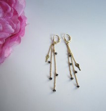 Beautiful designer 18 carat gold drop earrings with black diamond beads. Mint.