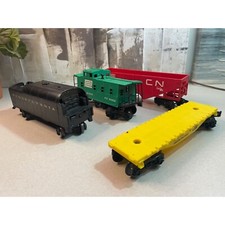 Lionel Trains Assorted Lot of 4 Cars Dump Caboose Flatbed
