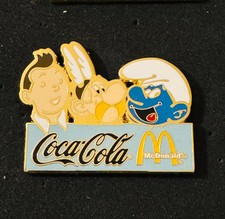 Pin's BD Tintin Astérix Schtroumpf Coca Mc Donald's