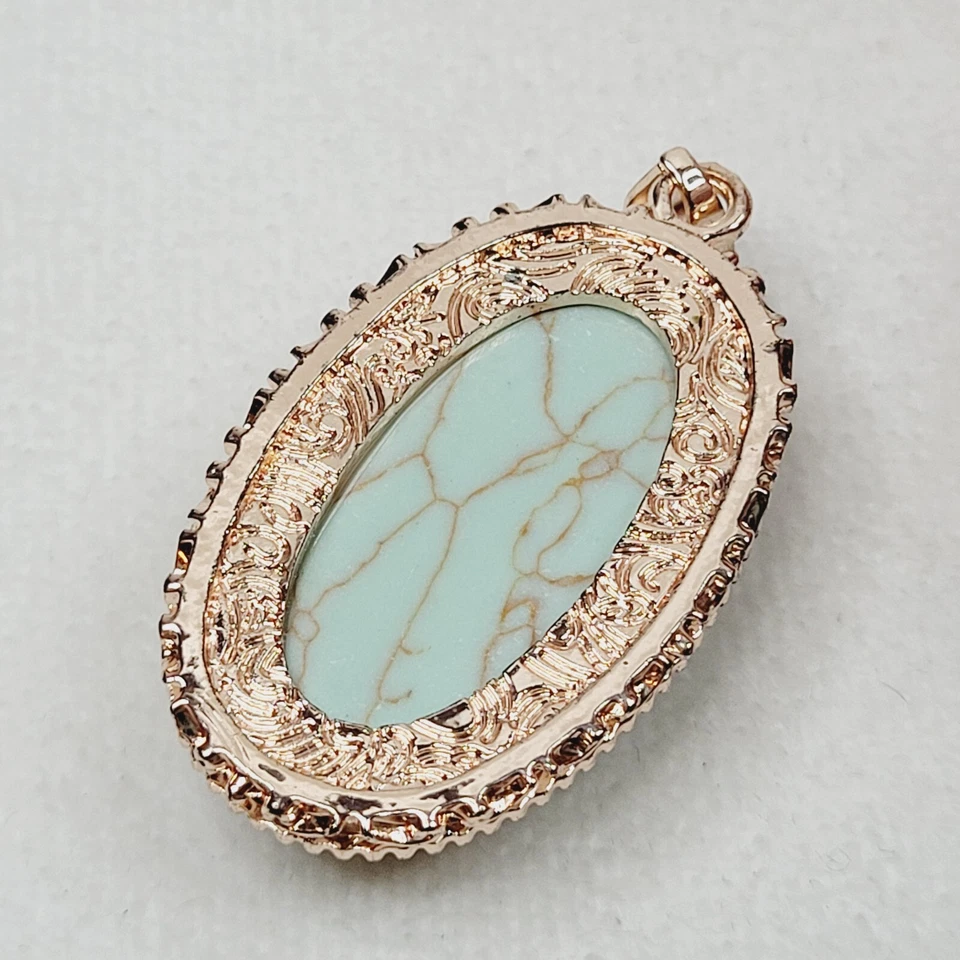 Colgante clásico ovalado de piedra azul claro ovalado tono oro rosa 1928 joyería de moda Foto 3 de 4