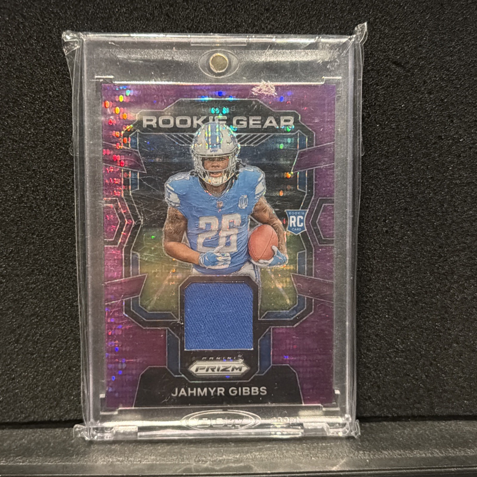 Jahmyr Gibbs 2023 Prizm Purple Pulsar Rookie Gear Relic #RG-JG Lions (RC, MEM)