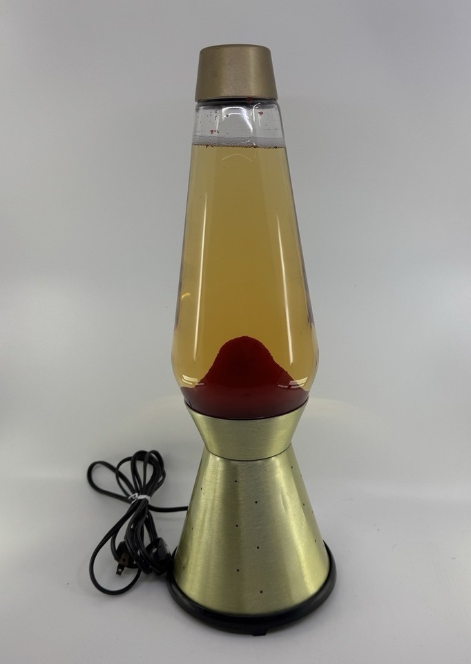 A 1970s Lava Lite Century 100 with the legendary gold Starlight pinhole base — one of the most sought-after vintage lava lamp configurations.