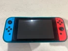 Nintendo Switch with charger, TV adaptor, additional controller..