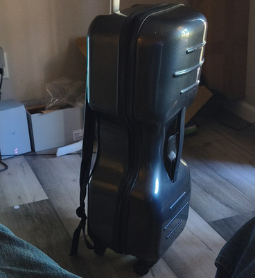 Hard Plastic Wheeled Cello Shaped  Case, Black, Carry Handle & Shoulder Strap