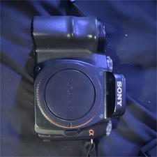 Sony  100 Camera Bundle, DT 18-50mm SAM Lens, 18-70mm Lens, Charger, Black