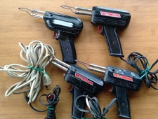 LOT OF 4 VINTAGE WELLER SOLDERING GUNS ALL TESTED AND WORKING.