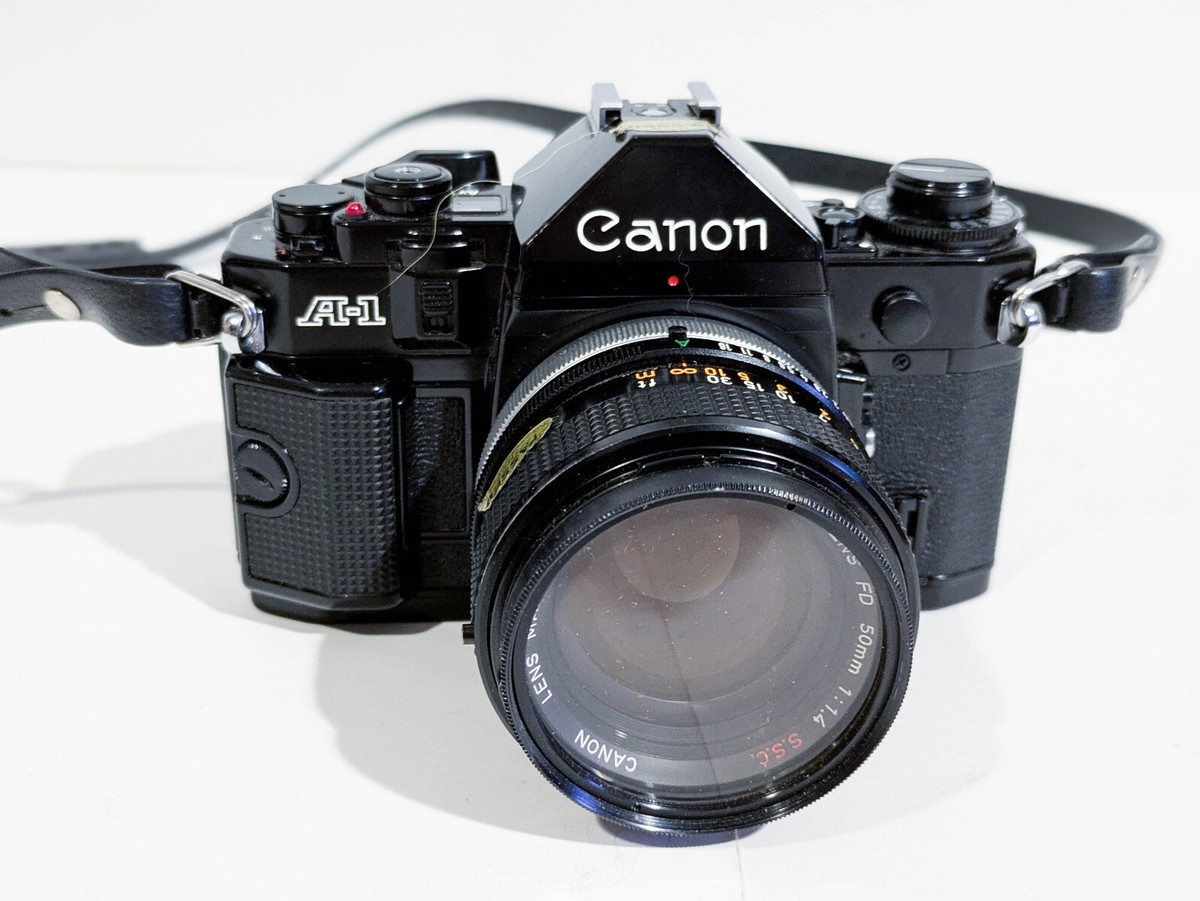 Canon A-1 35mm Film Camera With Lenses, Owner's Guide, Flash, Near