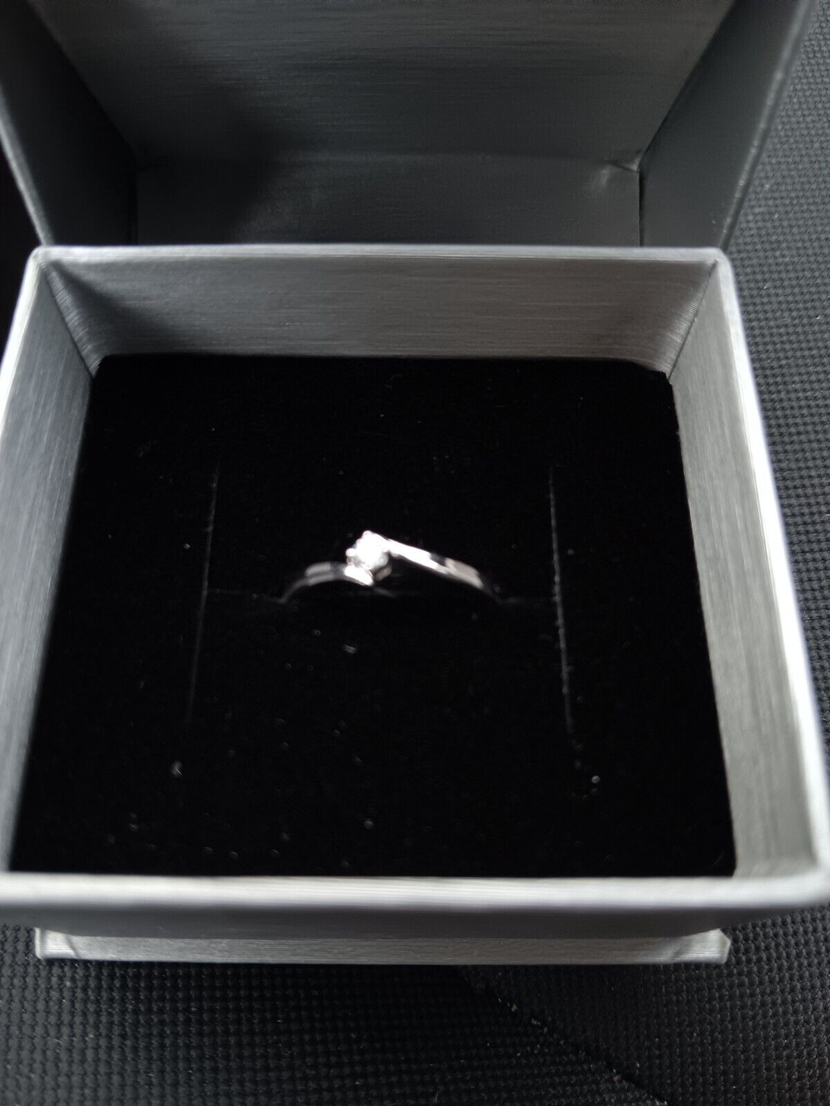A point 5 diamond engagement ring never worn or sized brand new still in box
