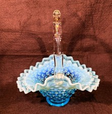 Glass basket with hobnail pattern in blue opalescent finish by Fenton Art Glass