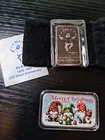 2 silver bars. (2 ounces total silver). Christmas & Alaska. Pretty. No reserve.