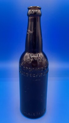 VINTAGE FURNITURE CITY BREWING CO EMBOSSED AMBER BEER BOTTLE - GRAND RAPIDS, MI