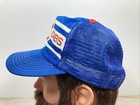 Blue snapback trucker hat with white and red stripe, embroidered “VTG Chicago Cubs” text in red and white, and red cap.