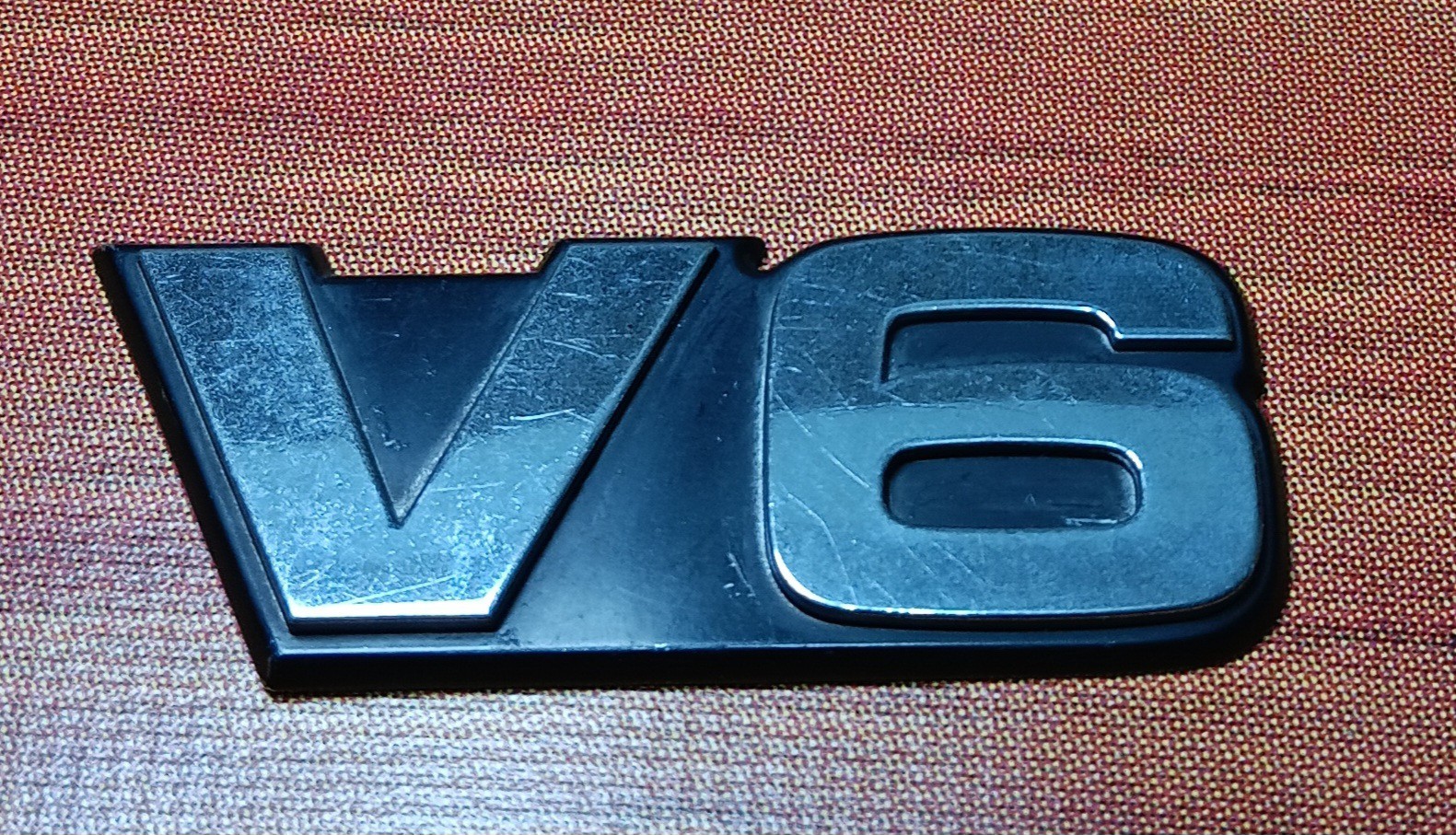 75312-42010 Toyota Emblem, radiator grille, Genuine OEM - Photo 1