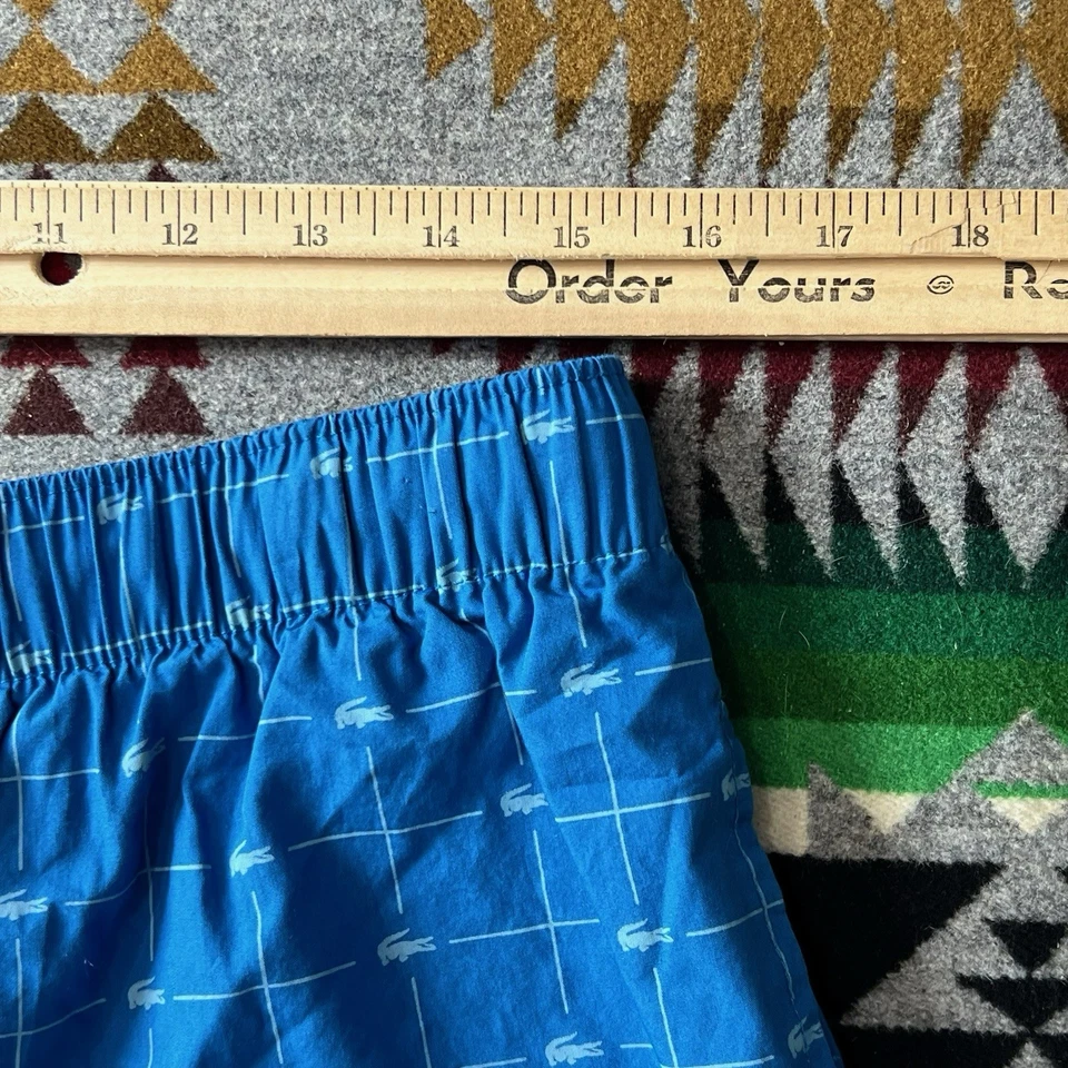 Pantalones cortos para dormir Lacoste para hombre medianos con estampado de logotipo azul bolsillos para salón C6 Foto 3 de 4