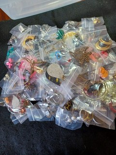 Huge lot of pierced earrings 100 in total. Many styles shapes sizes & colors.