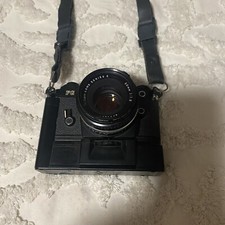 Nikon 35 Mm FG Camera With Two Lenses One 50 Mm In The Other One 105 Mm,