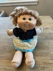 Cabbage Patch Kids Caucasian Green Eyes Curly Hair Doll.