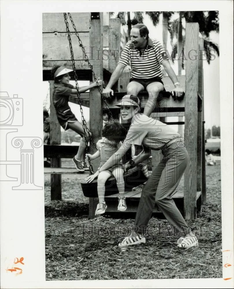 1979 Press Photo Family members wearing summer clothes enjoy time at playground
Opens in a new windo