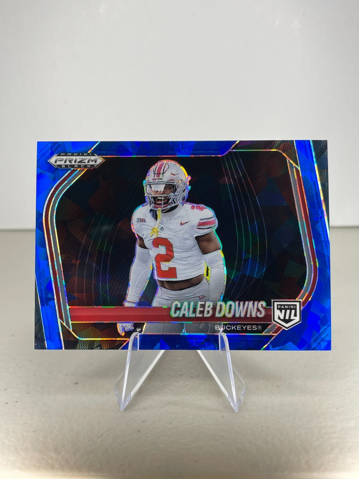2025 Panini Prizm Black - Caleb Downs #190 Blue Cracked Ice /125 (RC)