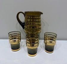 Bohemia Brown/Amber water set with gold trim and leaf design. 4 piece set.