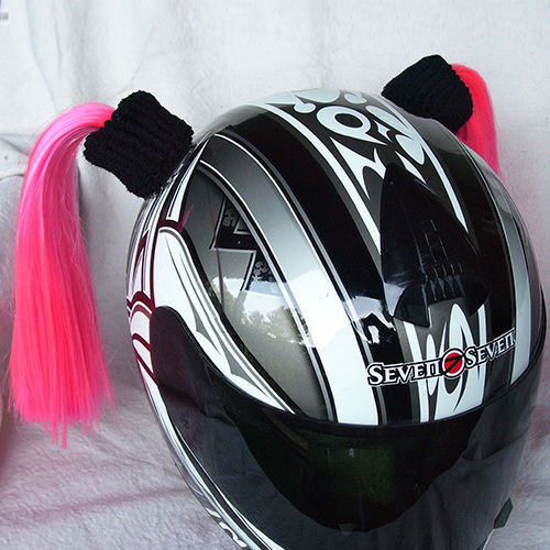 motorcycle helmet with pink pigtails