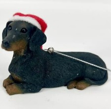 Black Short Haired Dachshund Dog in Santa Hat Christmas Ornament .