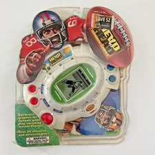 TIGER FOOTBALL HANDHELD HEAD TO HEAD TABLETOP QUATERBACK ELECTRONIC GAME '99.