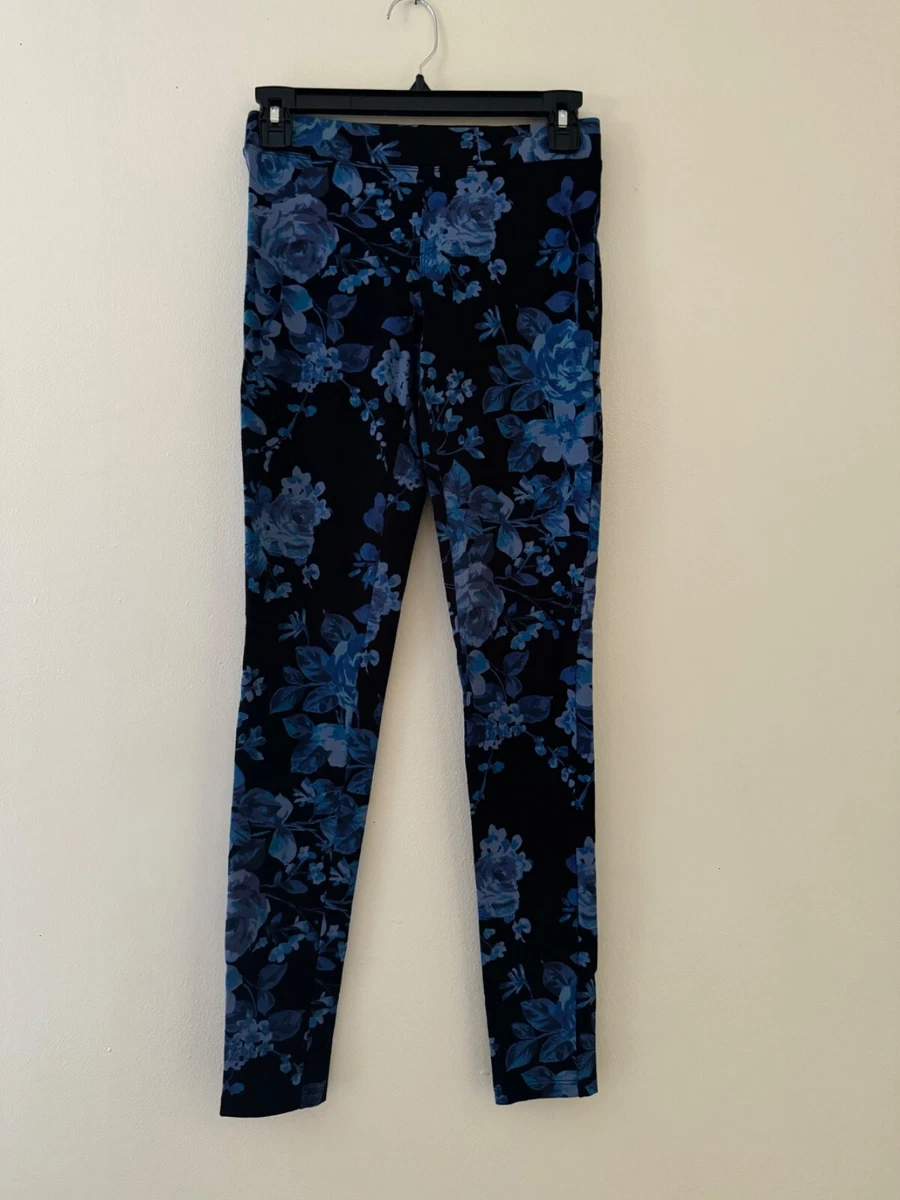 Black floral flare leggings has a mesh layer on top