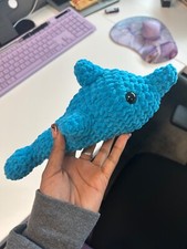 Amigurumi crocheted dolphin stuffed animal; message for different color