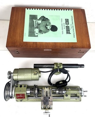 A VINTAGE ORIGINAL AUSTRIA UNIMAT ALUMINUM MODEL SL MINI LATHE (Red badge).