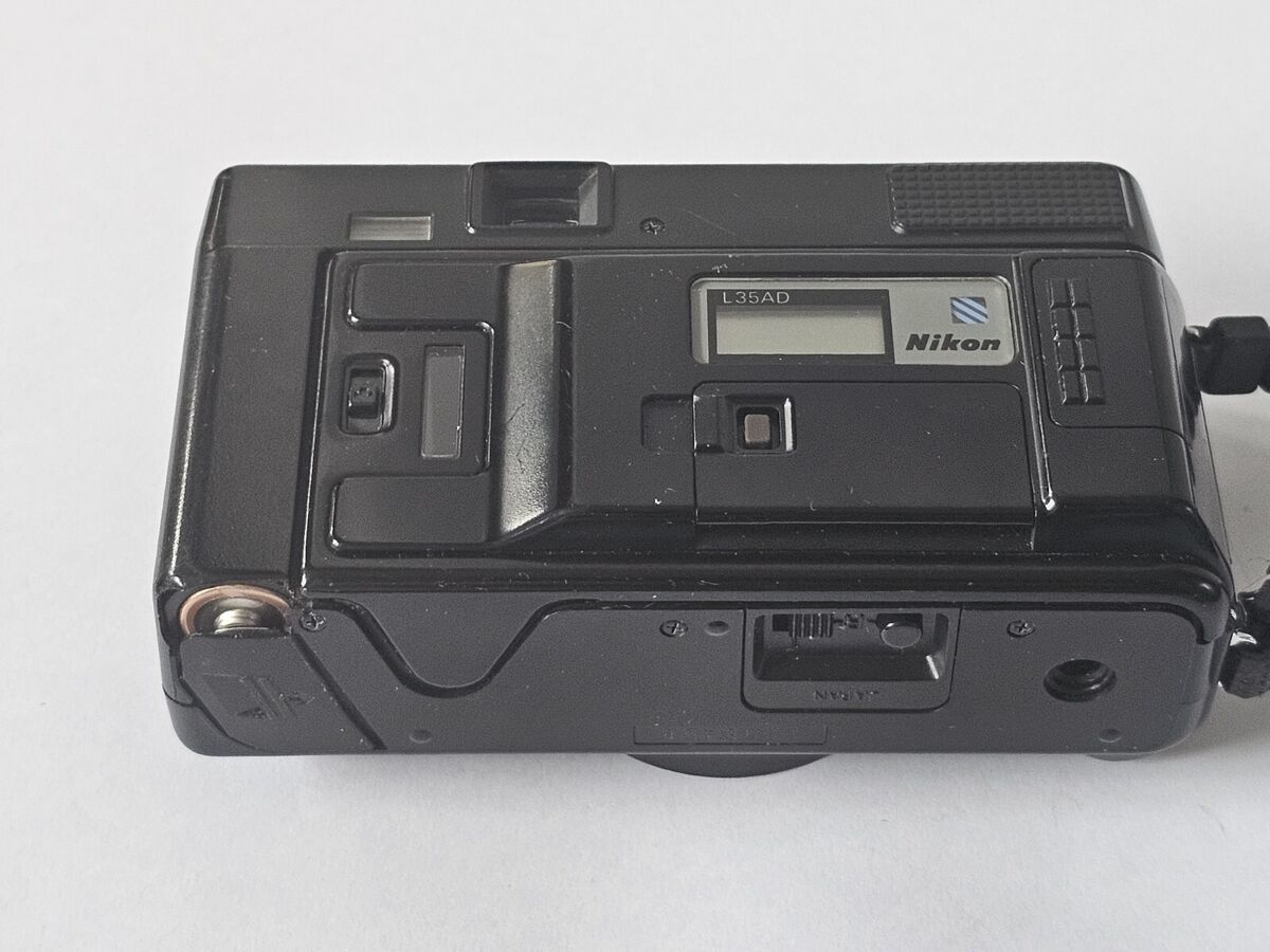 Nikon L35 AF Film CAMERA for RESTORATION 35mm lens f/2.8 ISO Nikon L35 AF Film CAMERA for RESTORATION 35mm lens f/2.8 ISO