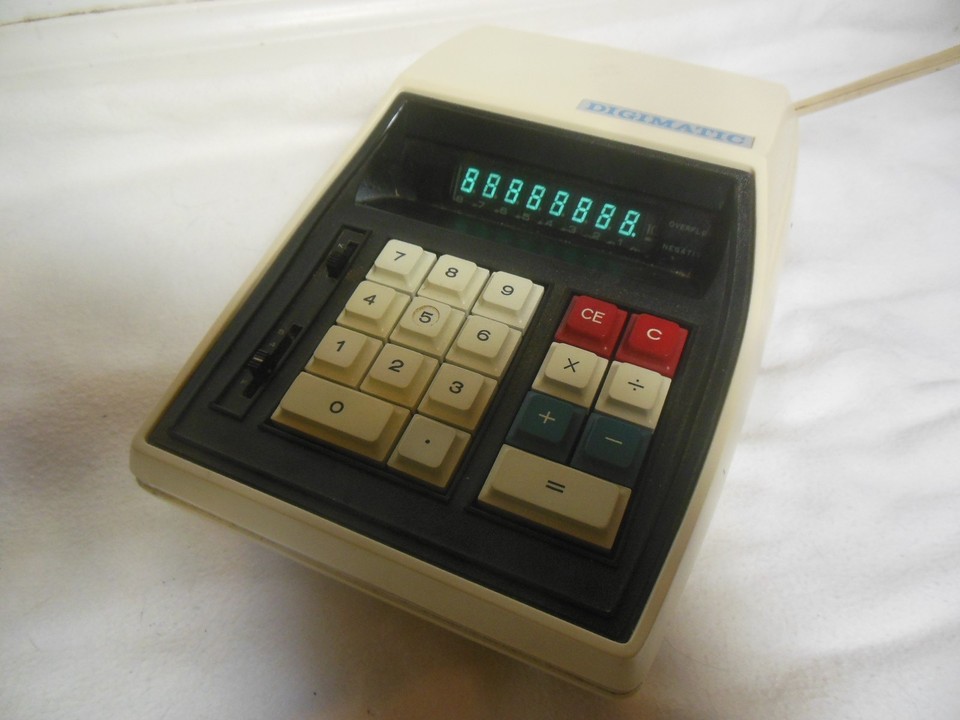 The Digimatic Mark I's VFD display gives it an eerie, beautiful glow that no modern screen can replicate — a rare, obscure model that's practically unknown, making it a true collector's gem.