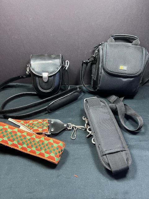 T) LOT 2 CAMERA CASES AND 2 STRAPS LEATHER AND CANVAS